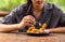 Chicken Nuggets impaled on a fork  and Dip sauce. A women eat Nuggets