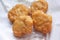 Chicken nuggets on white blotting paper oil