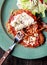 Chicken parmigiana with spaghetti and salad