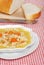 Chicken pasta soup with sliced bread