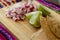 Chicken pozole with radishes, lemons and toast