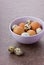 Chicken and quail eggs by Easter in a ceramic bowl