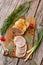 Chicken roll in grid decorated lettuce leaf isolated on wooden background. Fresh meat product whole and partly sliced