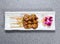 Chicken satay sticks served in dish isolated on grey background top view of hong kong food