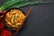 Chicken Schezwan Noodles or Hakka or Chow Mein in black bowl at dark background. Schezwan Noodles is indo-chinese cuisine hot dish