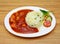 chicken shashlik or chicken manchurian with salad fried rice served in a dish isolated on grey background side view of indian,