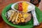 Chicken and shrimp fajitas with refried beans and rice
