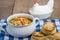 Chicken soup and biscuits on table