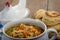 Chicken soup and biscuits on table