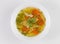 Chicken soup or broth with noodels, chicken meat pieces , carrot slices and herbs