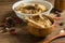 Chicken soup and wooden background