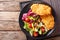 Chicken steak in breading Panko and fresh salad close-up on the