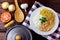 Chicken stroganoff, pan and ingredients. In Brazil it is composed of sour cream with tomato extract, rice and potato sticks, on