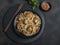 Chicken teriyaki with asian noodles udon , sesame, rustic stone background. Closeup. Chinese/Japanese noodles