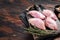 Chicken thigh fillet, Raw Boneless and skinless meat on a cutting board. Wooden background. Top view. Copy space