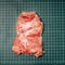Chicken thigh ,leg meat on a line board. Raw skinless boneless chicken thigh, for cooking.