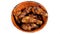 Chicken thighs marinated in spices, grilled, arranged in a fine wooden bowl, on white background