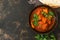 Chicken Tikka masala in the bowl. Asian food. Top view, copy space.