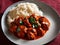 Chicken Tikka Masala dish with rise