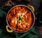 Chicken Tikka Masala served in a dish isolated on dark background top view