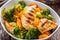 Chicken and vegetable salad. Pieces of grilled chicken with carrots and broccoli