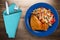 Chicken wing with vegetable salad on a wooden background