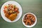 Chicken wing with vegetable salad on a wooden background