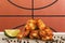 Chicken wings with a basketball ball image in background
