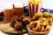 Chicken wings, fries and onion rings for football on a table. Great for Bowl Game