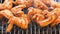 Chicken wings roasting on a charcoal barbecue grill