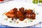 Chicken wings in sauce teriyaki grilled