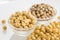 Chickpea grains in bowl on white background