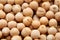 Chickpea groats background. Chick peas, or garbanzo beans, are a type of legume. Closeup