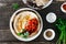 Chickpea hummus flatbread cherry tomatoes spice dark wooden table top view