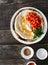 Chickpea hummus flatbread cherry tomatoes wooden table top view