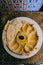 Chickpea hummus, pita chips, paprika and parsley. typical Arabic tiles in the background