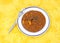 Chickpea masala on yellow cloth with fork