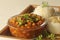 Chickpea in a thick gravy of onions tomatoes and spices. Served with hot steamed rice and spiced cur