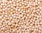 Chickpeas background. Dried chickpea beans, close up pattern background, top view.