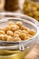 chickpeas being sieved to extract aquafaba, cooking liquid used as an alternative to egg whites