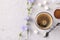 Chicory beverage in glass cup, with concentrate and flowers on grey background. Healthy herbal beverage, coffee substitute, Close