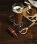 Chicory root coffee with milk foam in a tall glass on a dark wooden background, vertically