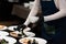 chief serving mussels in white wine sauce and white bread toasts