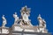 Chigi coats of arms and the statues of saints that crown the colonnades of St. Peter Square built on 1667 on the