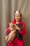 Chihuahua and the Canadian sphynx. Cheeky cat and brave dog. Girl in her arms with a sphinx and chihuahua
