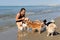 Chihuahuas and girl on the beach