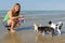 Chihuahuas and girl on the beach
