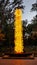 Chihuly Glass Sculpture in Yellow and Red with Water Reflection Pool