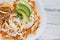 Chilaquiles rojos with chicken and avocado mexican food mexico breakfast