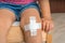 Child with adhesive bandage on knee